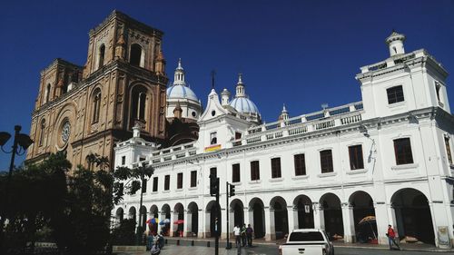 Low angle view of buildings against sky in city