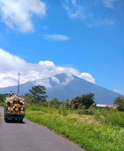 Cars on road against sky