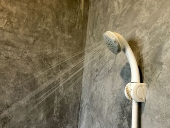 Low angle view of electric light on wall at home