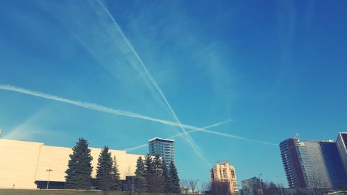 Low angle view of buildings against blue sky