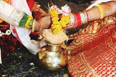 Low angle view of hands on cross