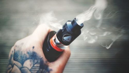 Low section of man photographing