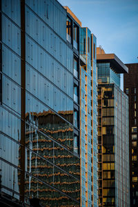 Low angle view of modern buildings against clear sky