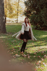 Full length portrait of woman in sunlight