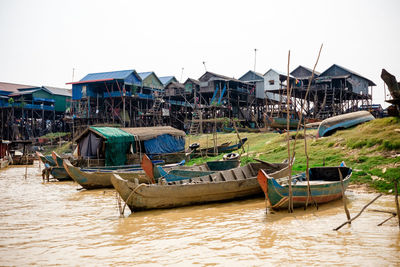 Boats moored at harbor