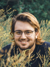 Portrait of a young man in the grass