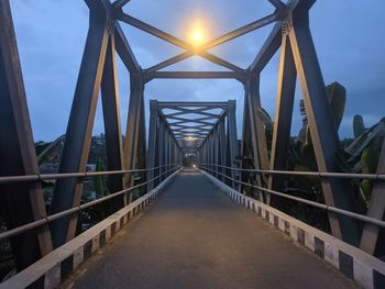 View of footbridge against sky