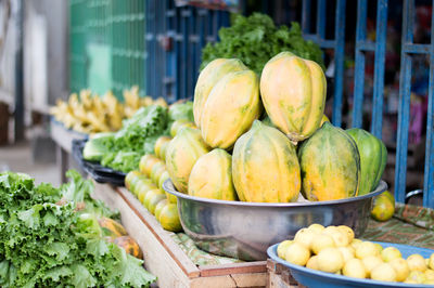 Fresh fruit and vegetables on shelves for health.