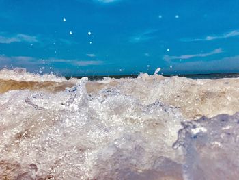 Close-up of waves splashing on beach