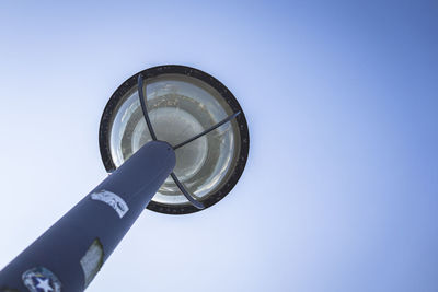 Low angle view of telephone pole against clear sky