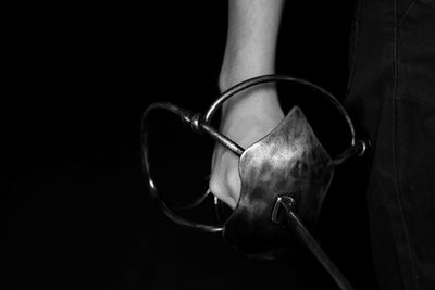 Close-up of mannequin against black background