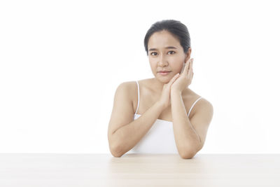 Portrait of a beautiful young woman over white background