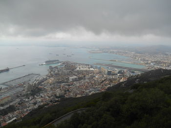 High angle view of city against cloudy sky