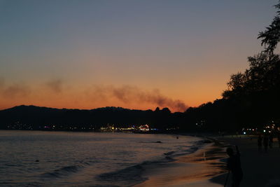 Scenic view of sea against sky at sunset