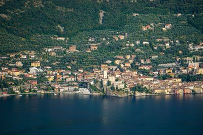 High angle view of townscape by sea