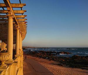 Scenic view of sea against clear sky at sunset