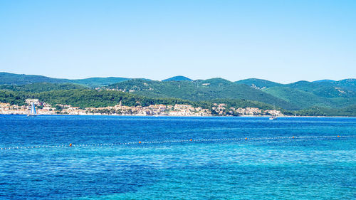 Scenic view of sea against blue sky