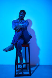 Low angle view of woman sitting on stage