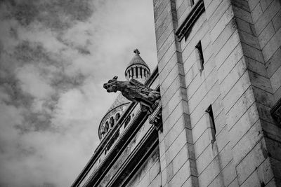 Low angle view of sacred heart's gargoyle