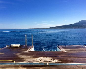 Scenic view of sea against clear blue sky