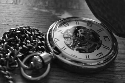 Close-up of old clock on table