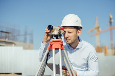 Rear view of man working at airport