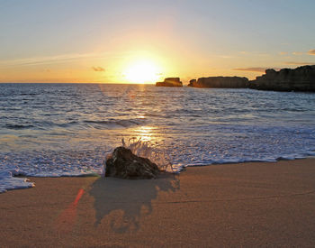 View of beach against sky during sunset