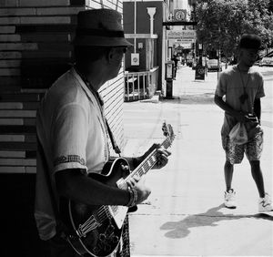 Man playing guitar on street