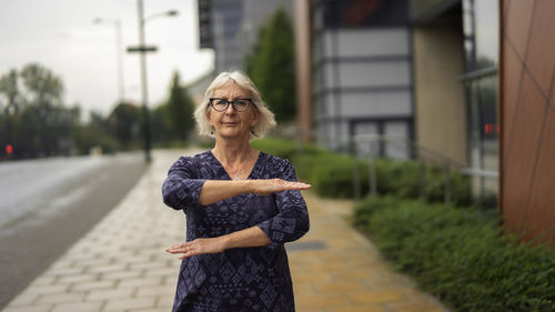 Portrait of woman standing outdoors