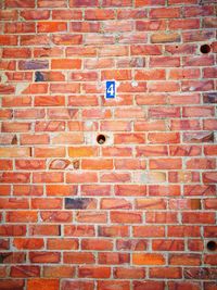 Full frame shot of red brick wall