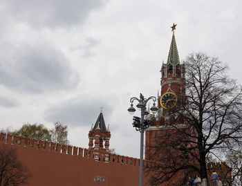 Low angle view of clock tower against sky