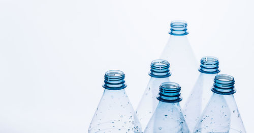 Close-up of glass bottle against white background