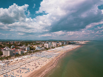 High angle view of sea and buildings against sky