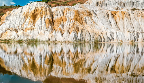 Kaolin mining with beautiful slopes reflecting in the lake, vetovo village, bulgaria