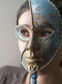 Portrait of man wearing mask against white background