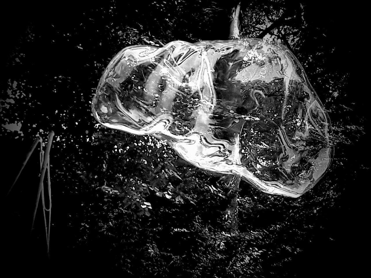 CLOSE-UP OF BUBBLES IN WATER AGAINST GLASS