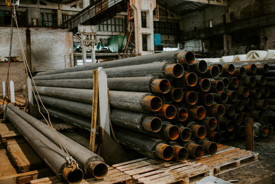 Stack of old pipes in abandoned factory