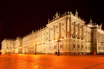 Facade of historical building at night