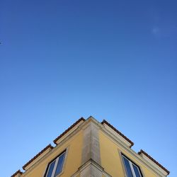 Low angle view of building against blue sky