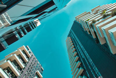 Low angle view of buildings against blue sky