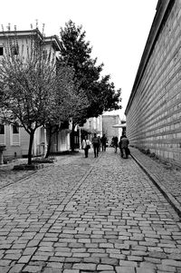 Full length of woman walking on footpath