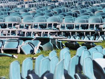 High angle view of empty chairs on field
