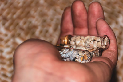 Close-up of person holding hand