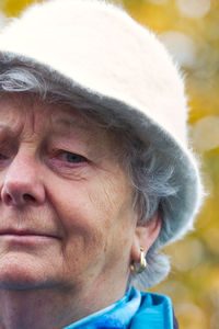 Close-up portrait of mid adult woman looking away