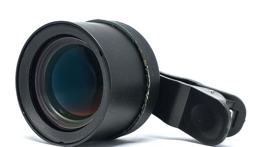 Close-up of camera against white background