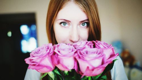 Portrait of young woman at home