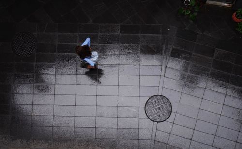 High angle view of man shadow on floor