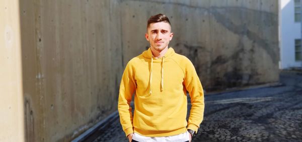 Portrait of young man standing outdoors