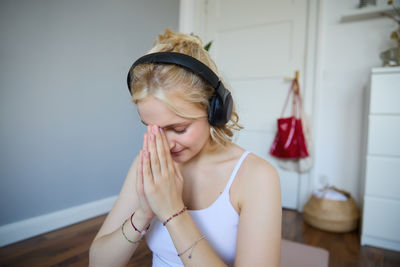 Portrait of young woman in bathroom