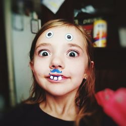 Close-up portrait of girl with costume at home